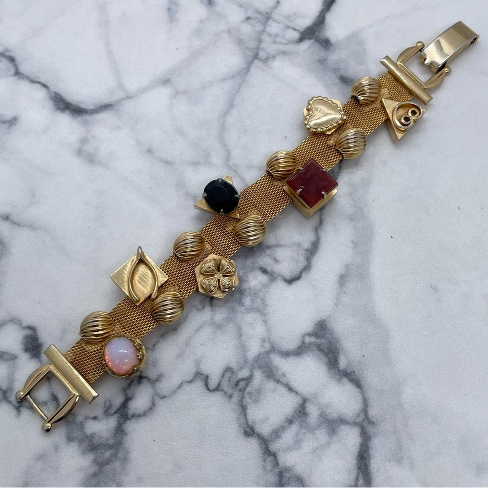 Vintage Gold Tone Mesh Bracelet with Charms Attached Wishbone Flower Faux Opal